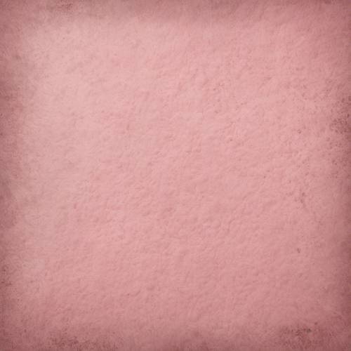 Ein rosa Rouge, kunstvoll auf ein Stück strukturiertes Papier in neutralen Tönen aufgetragen.