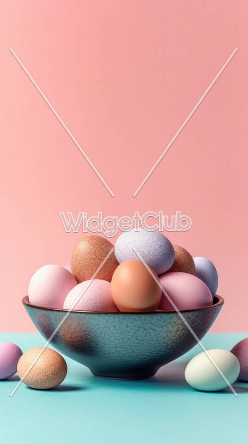 Huevos coloridos en un recipiente sobre fondo rosa