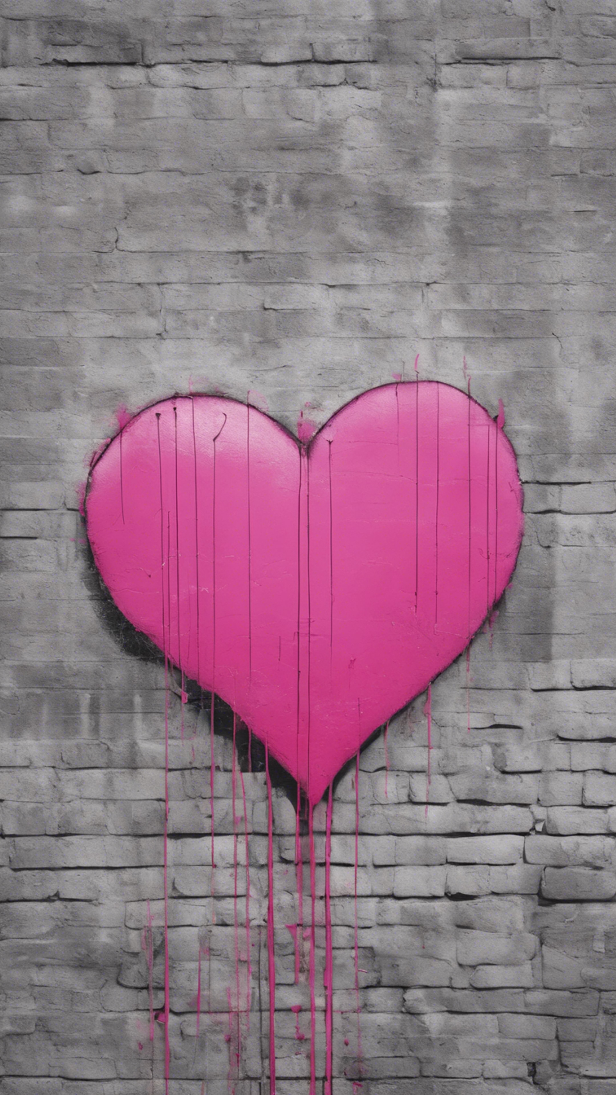 A minimalist pink heart graffiti spray painted on a city wall.壁紙[fd4dbafbb65a4217be27]