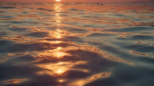 Une mer calme reflétant les teintes colorées d&#39;un coucher de soleil avec « Je suis plein de potentiel » gravé sur la surface de l&#39;eau.