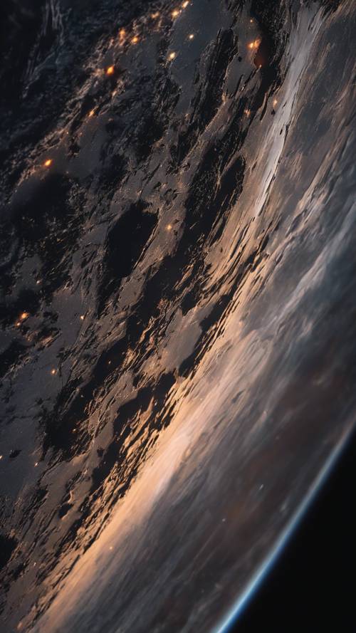 A space gray iPhone 11 Pro with its screen glowing, displaying the earth from space wallpaper.