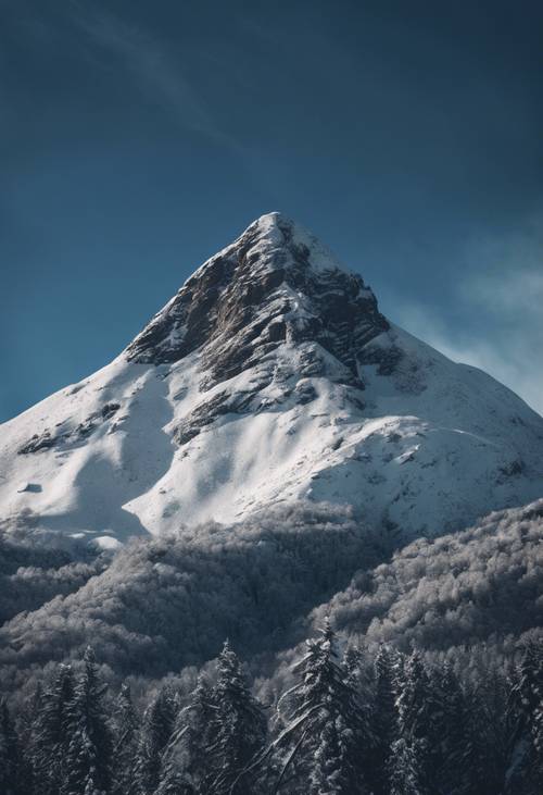 Snowy mountain peak under a foreboding dark blue sky