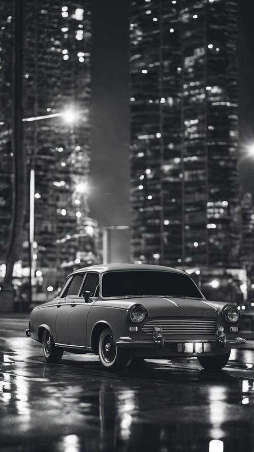 城市夜空下，一輛不同灰色深淺的幾何汽車。