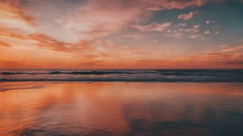 Un tramonto infuocato sull&#39;oceano con una citazione incoraggiante rappresentata come una silhouette.