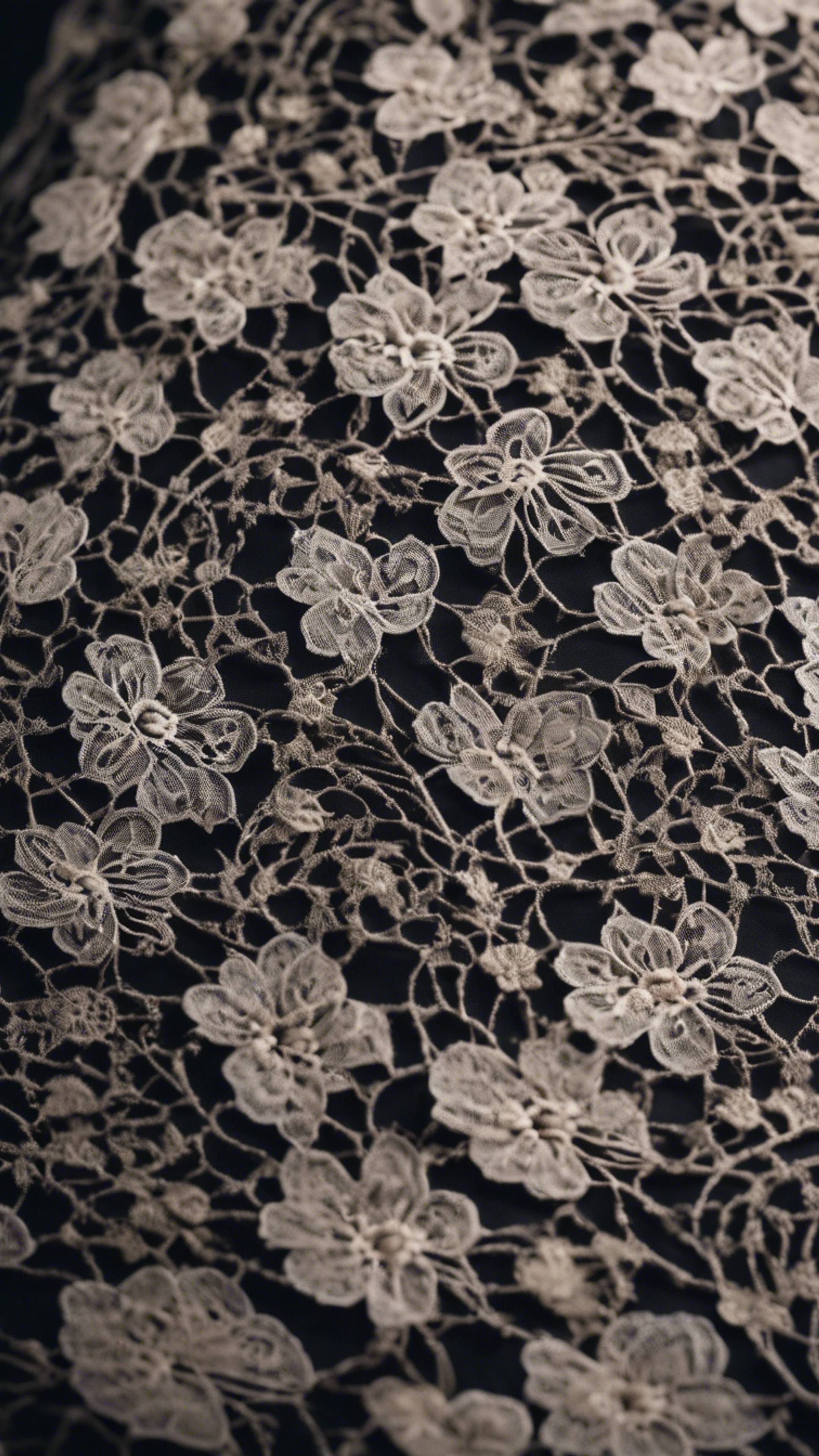 Close up of black lace with delicate floral pattern