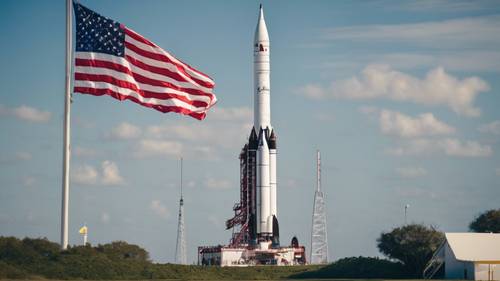 Une exposition de fusées historique à Cap Canaveral, avec un ciel bleu clair et le drapeau américain flottant en arrière-plan.