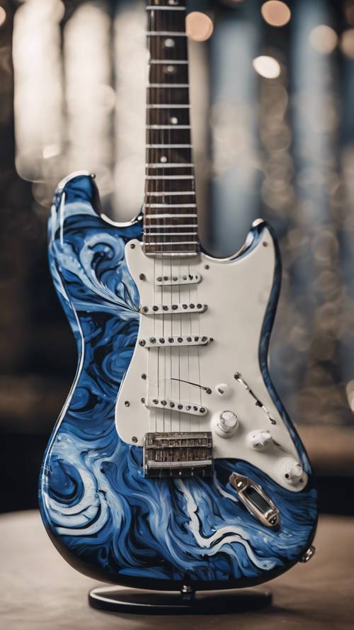 An electric guitar with a blue and white swirl design placed on a black stand.