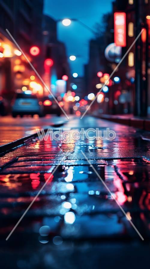 雨の夜の都会の光が反射する壁紙