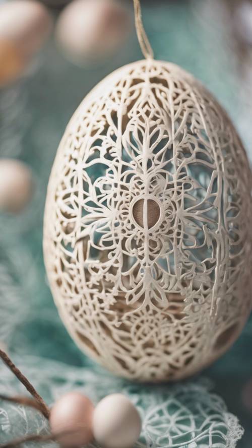 Close-up of a delicate hollow Easter egg ornament with intricate lace patterns.