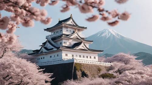 An ancient Japanese castle perched on a hill above a sea of cherry blossom trees in full bloom.