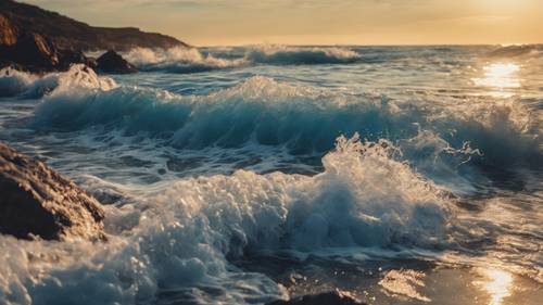 Blue waves dash playfully against a rocky seashore under a setting sun