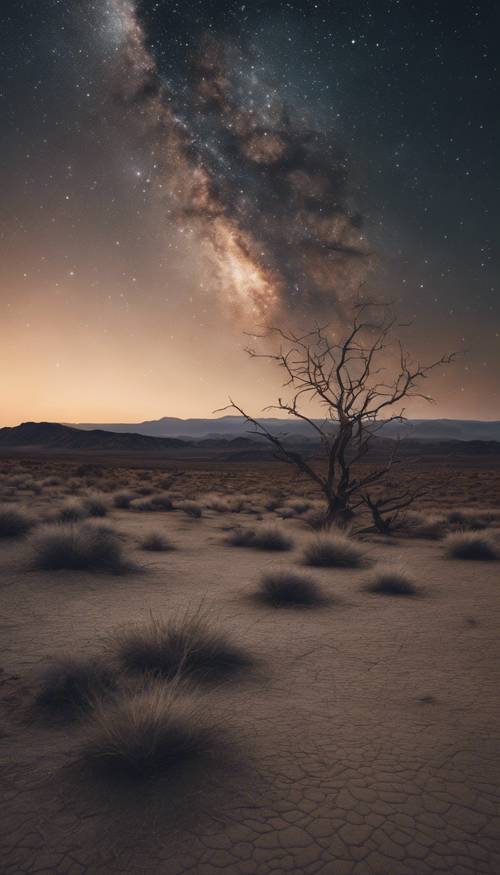 A serene night sky over a barren landscape.