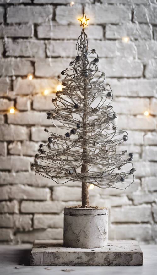 A small Christmas tree made of wire against a peeling white brick wall