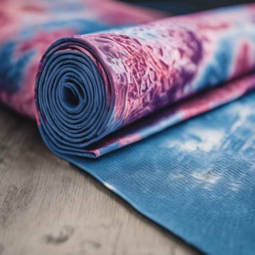 Une photo d&#39;un tapis de yoga avec un motif tie-dye bleu.