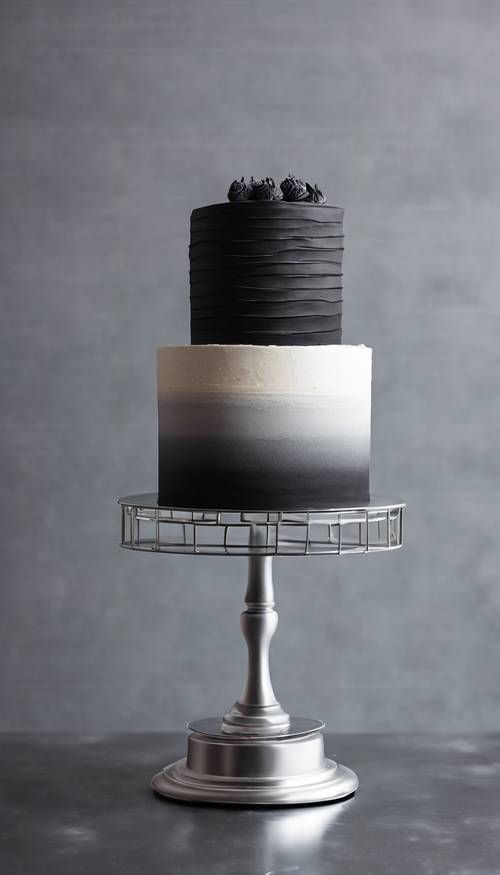 A black ombre cake on a silver stand, set on a minimalist backdrop. Tapet [42efe48956dd47408cce]