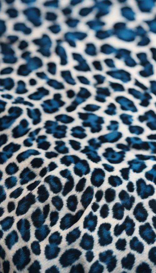 A close-up of blue leopard print on a silky fabric Tapet [68b303fd8abe4b5f837f]