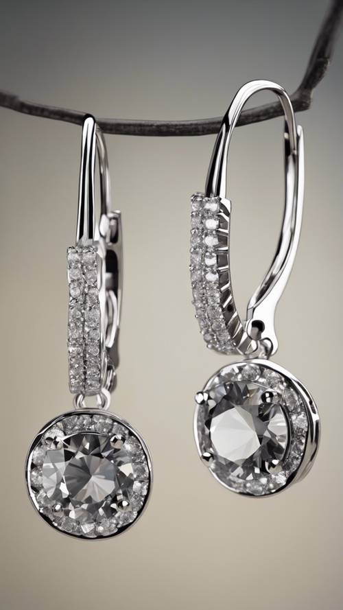 A pair of gray diamond hoop earrings swinging gently.