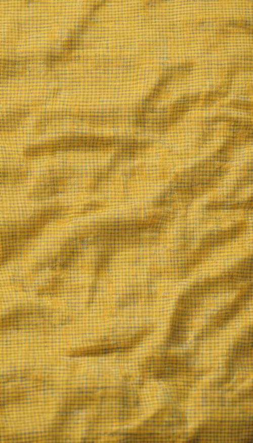 A close-up of a yellow checkered cotton fabric material, ready to be tailored Tapeta [a7f0355c45dc45bab1de]