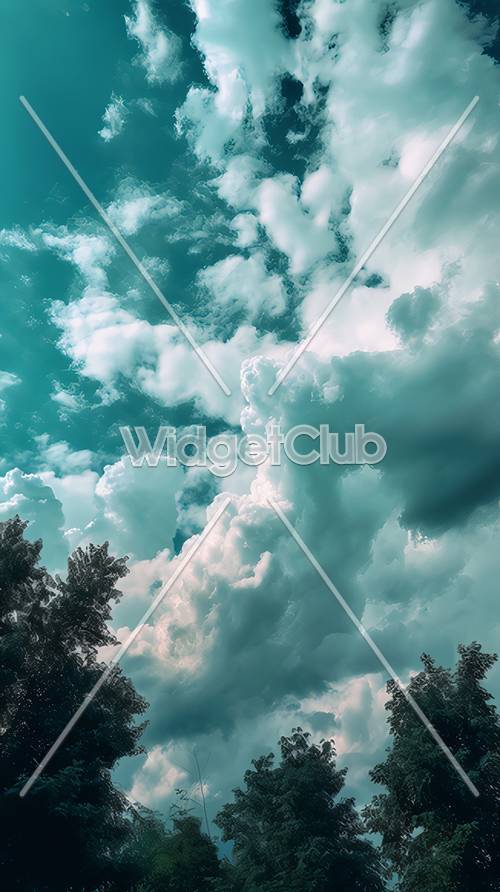 森の背景に広がるふわふわ雲と青い空壁紙