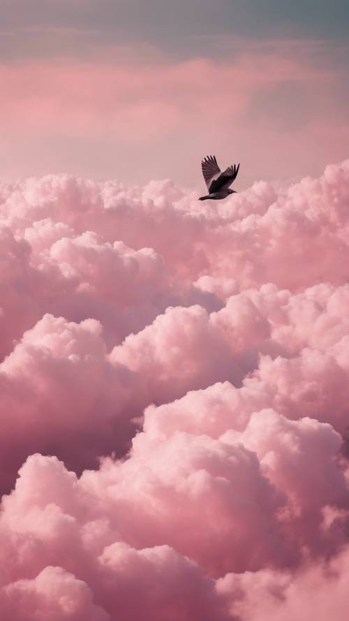 ピンクのふわふわ雲の海に1羽の鳥が飛んでいる