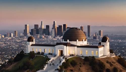 Griffith Observatory perched on a hill with the expanse of Los Angeles cityscape below.