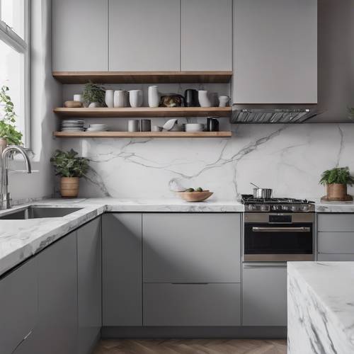 Una cucina minimalista con mobili grigi, elettrodomestici in acciaio inossidabile e ripiani in marmo.
