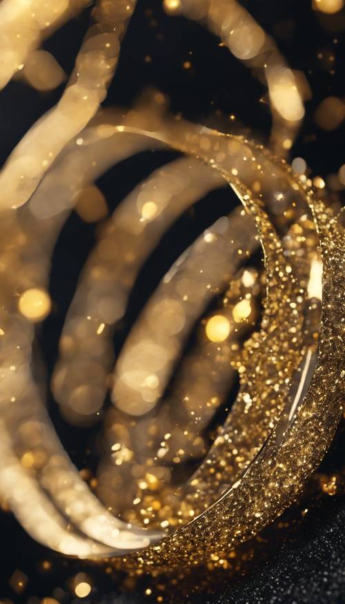 A close-up view of black and gold glitter sparkling under bright light