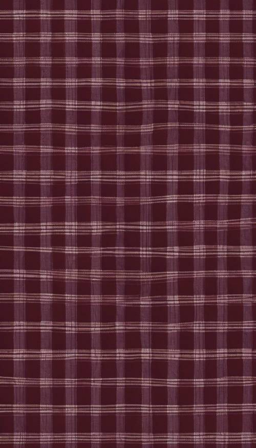 A detailed seamless pattern of burgundy and black plaid.