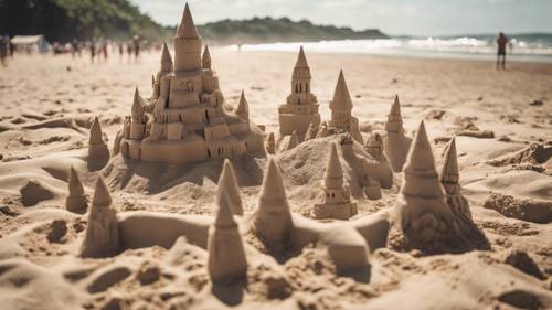 Local artists sculpting massive sandcastles on a beach on a bright July afternoon. Шпалери [ded69dcc86cc417d805c]