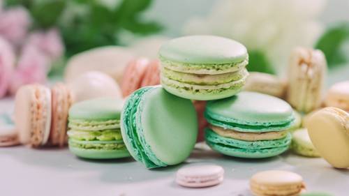 A soft light green macaron among other pastel colored macarons.
