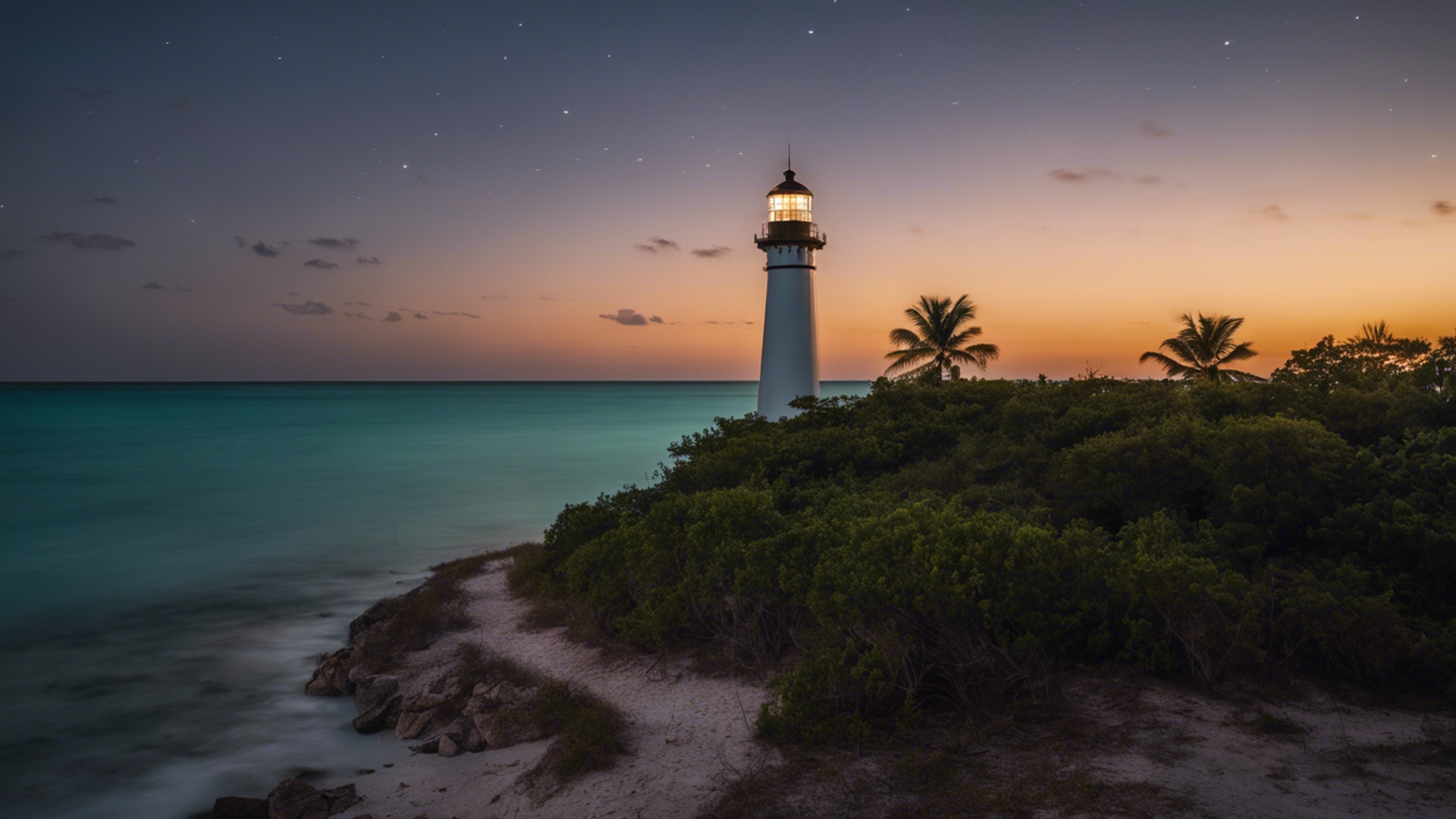 A night shot of an historic lighthouse in Key Biscayne, with the beam of light cutting through the darkness. Обои[4d5993bb763c4a90b239]