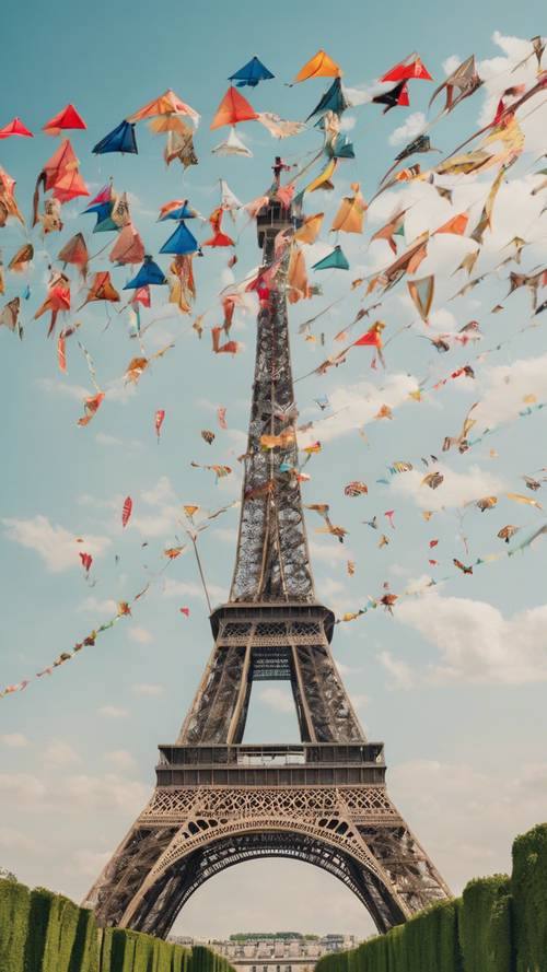 Numerous colorful kites flying around the Eiffel Tower on a breezy summer day.