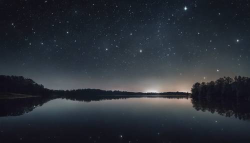 Orion constellation shining brightly in a clear, dark night sky over a serene lake.