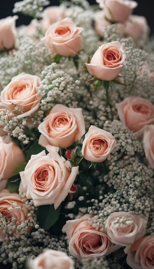 A bunch of cute roses surrounded by baby's breath in a beautiful bouquet.