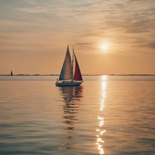 Perahu layar berwarna merah putih berlayar melintasi laut yang tenang dengan pancaran sinar keemasan matahari sore terpantul di permukaan air.