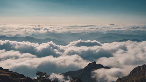 Um mar tranquilo de nuvens visto do pico de uma montanha, uma citação reconfortante flutuando com o vento. Papel de parede [ab3fb8cd0efc43deacc7]