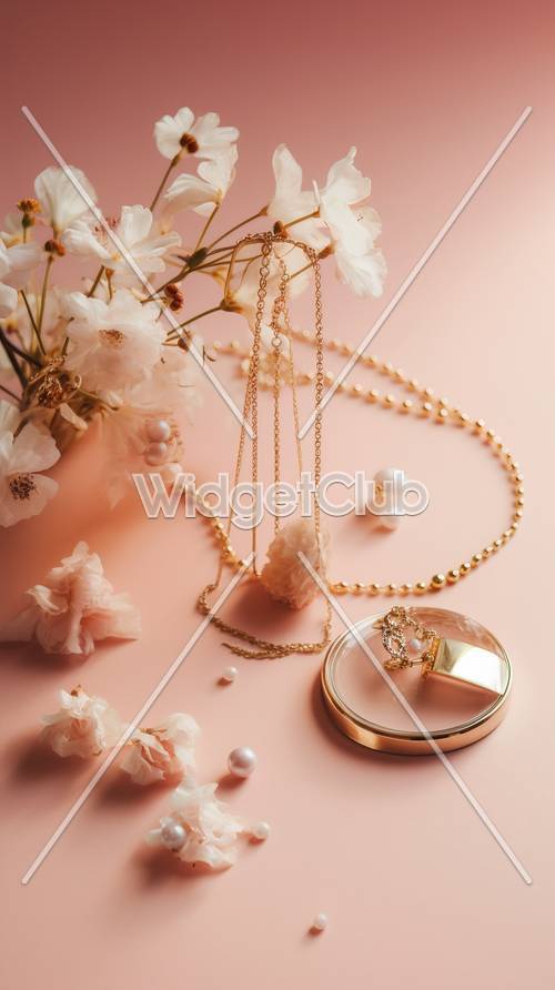 Bijoux élégants et fleurs sur rose