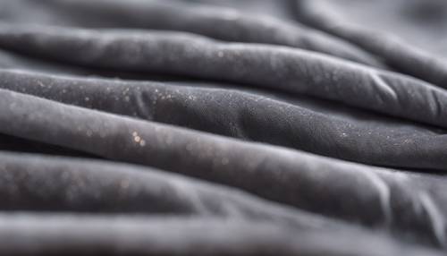 A close up of grey velvet fabric capturing its rich textures.