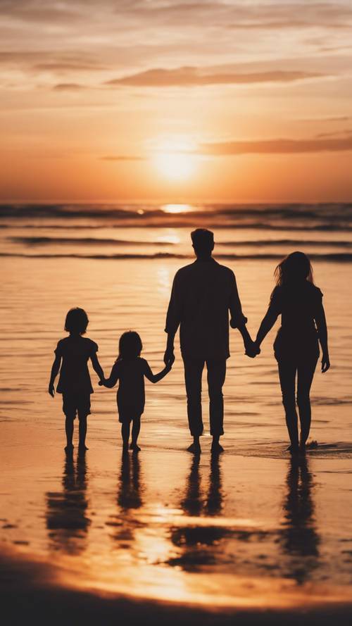 A silhouette of a family holding hands against a vibrant sunset on a tranquil beach.