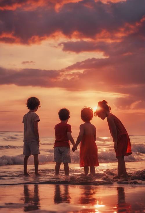 孩子們在海灘上玩耍，堆沙堡，夕陽西下，天空被染成紅色和橙色。