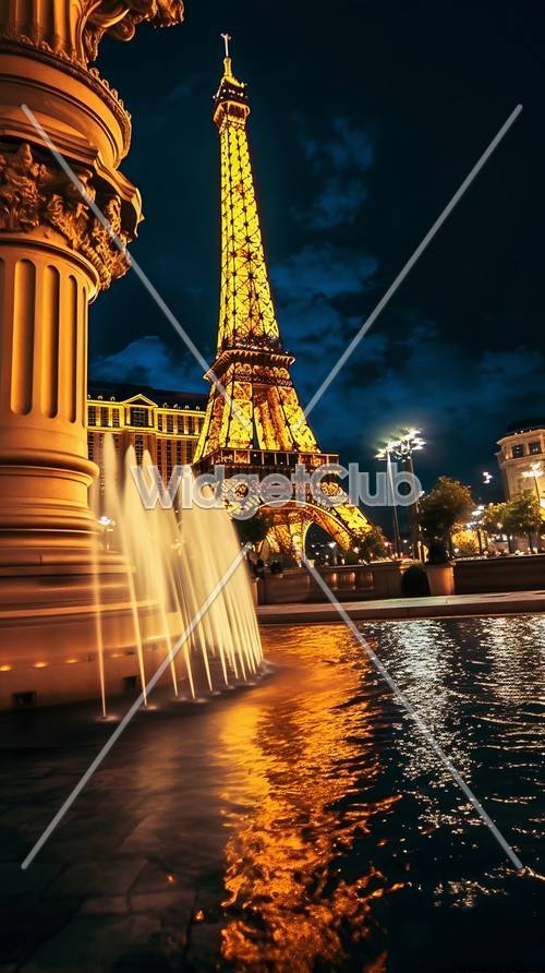 Tháp Eiffel thắp sáng vào ban đêm với đài phun nước