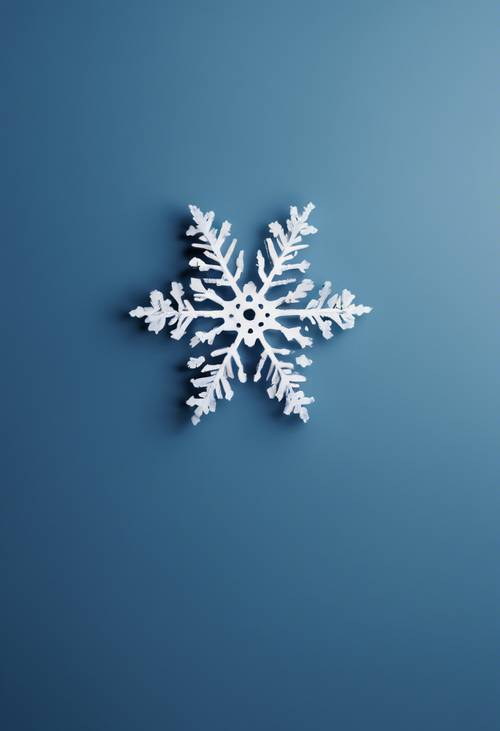 A simple, minimalist snowflake design on a rich blue background for a Christmas card