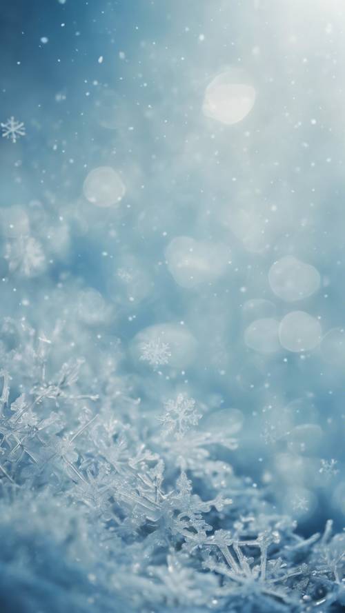 冬に薄い青の壁紙に描かれた雪の結晶