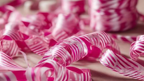 Pink and white striped party streamers enhancing the festive vibe of a birthday party.