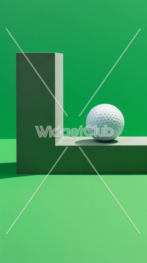 緑の抽象画に載った白いゴルフボール