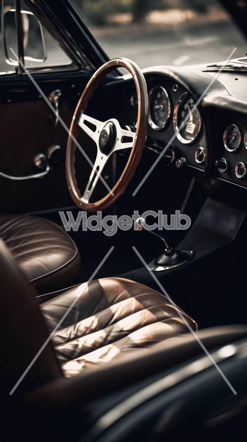 Interni d&#39;auto d&#39;epoca con eleganti sedili in pelle e volante in legno