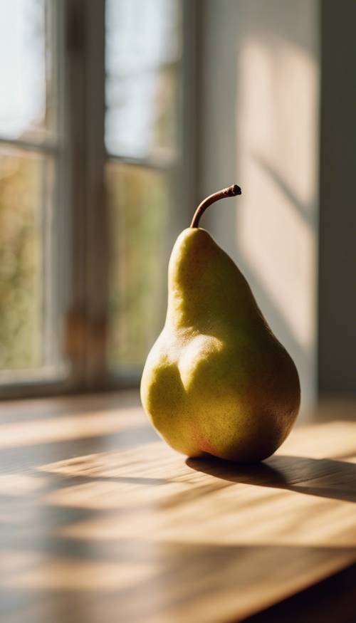 A ripe, fresh pear standing upright on a wooden kitchen table in morning sunlight.