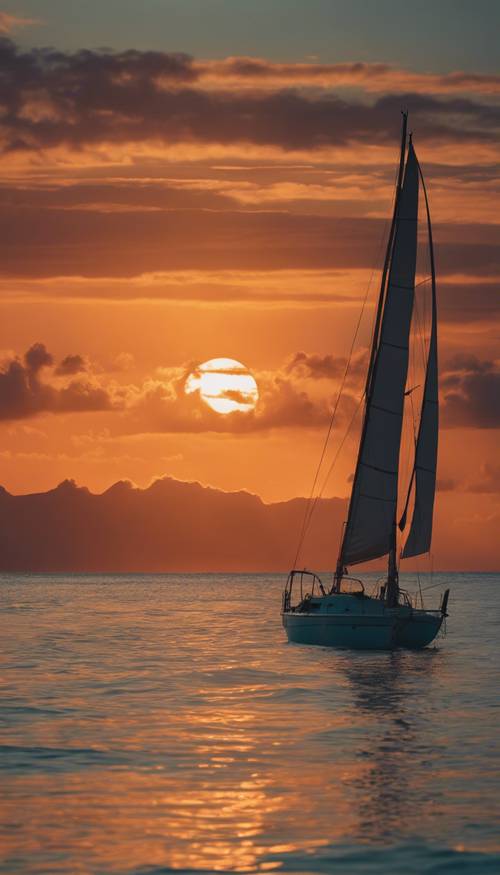 An azure Hawaiian sea at sunset, with a single sailboat silhouetted against the rich orange sky.