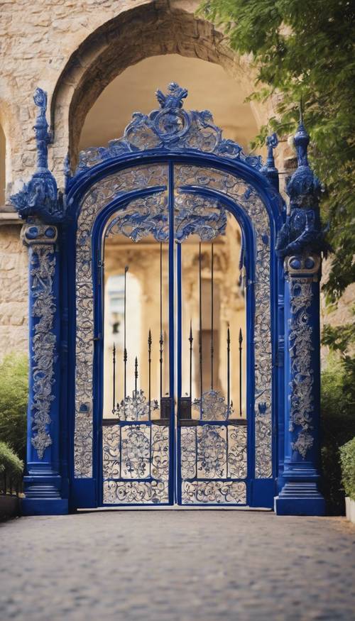 A grand royal blue entrance gate with intricate ivory carvings, leading into a centuries-old castle.