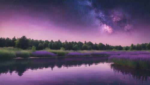 A calm lake mirroring the lavender-colored twilight and indigo night sky.